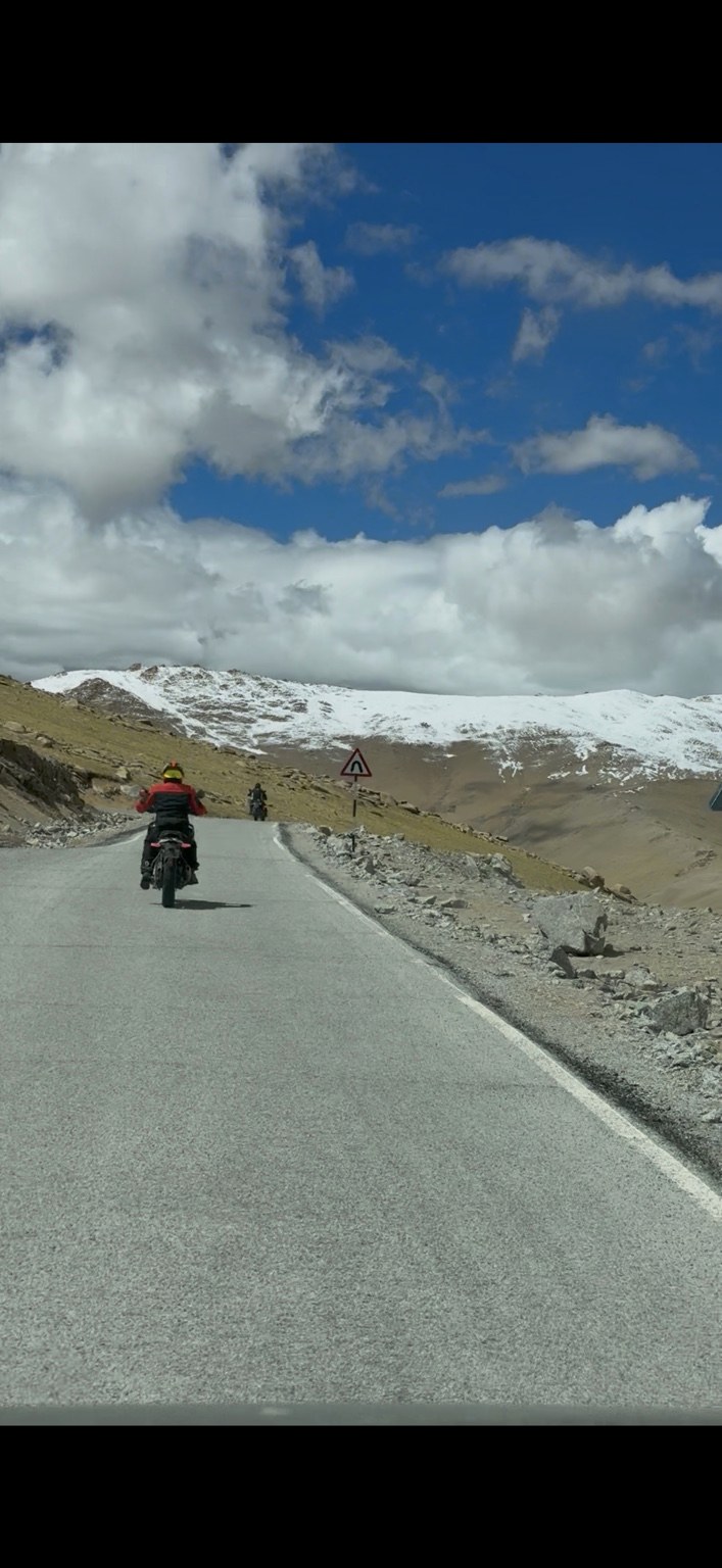 Rider climbing a Ladakh mountain road
